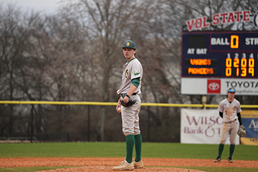 Viking baseball players standing on the pitcher's mound in uniform