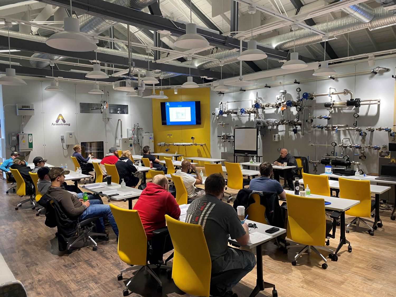 area workforce sitting in a training program in a manufacturing facility